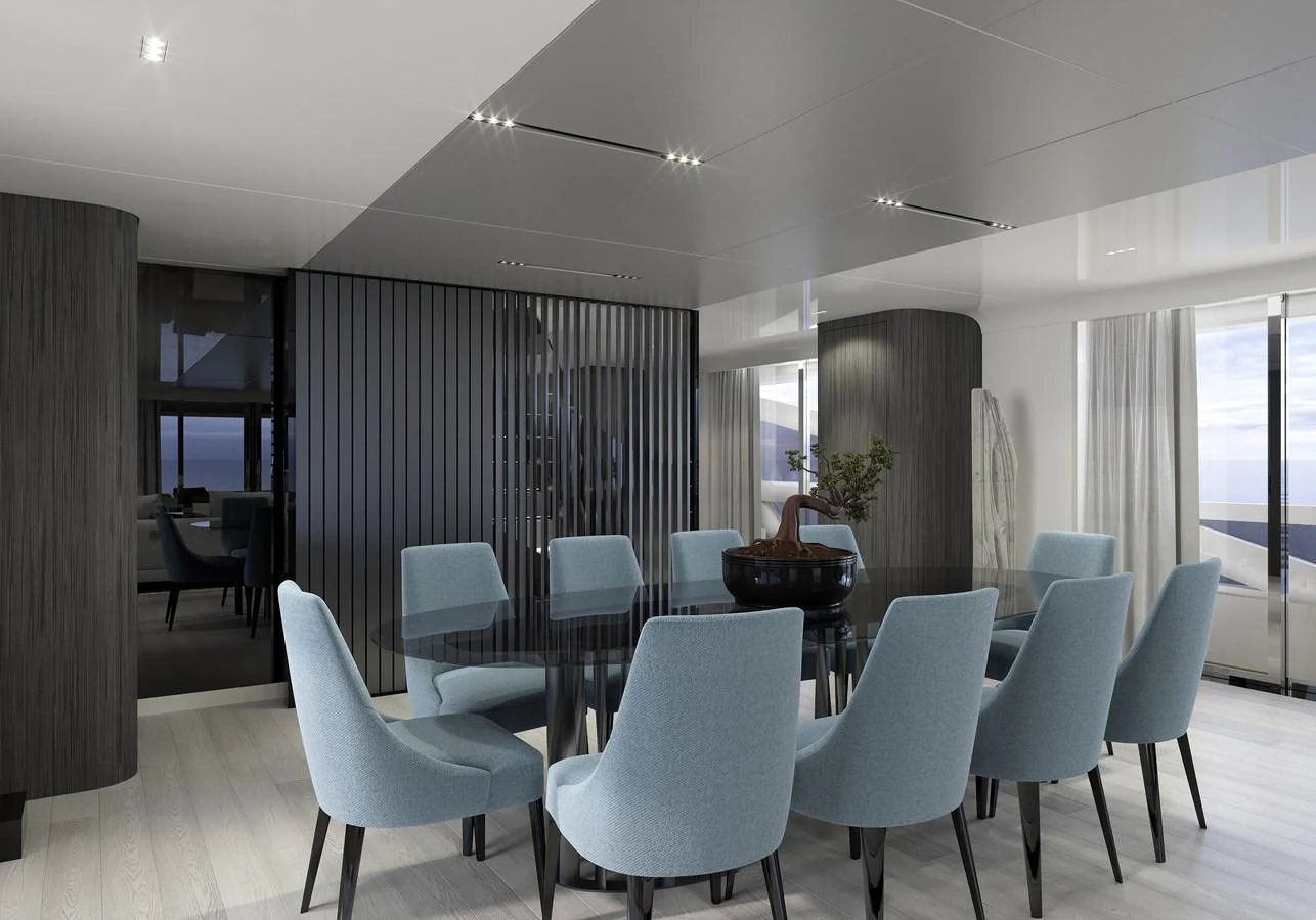 a room with a table and chairs aboard LEGASEA Yacht for Sale