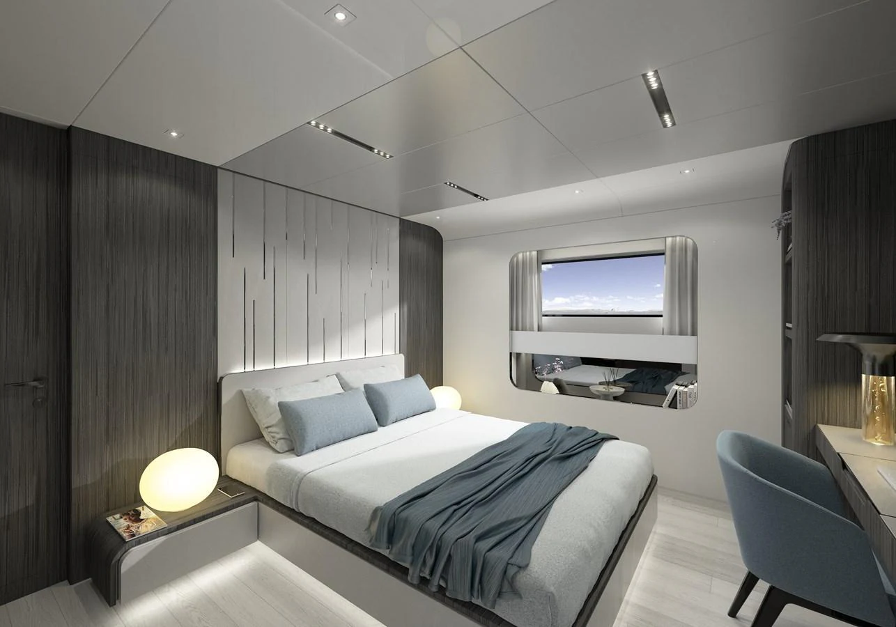 a bedroom with a bed and a television aboard LEGASEA Yacht for Sale