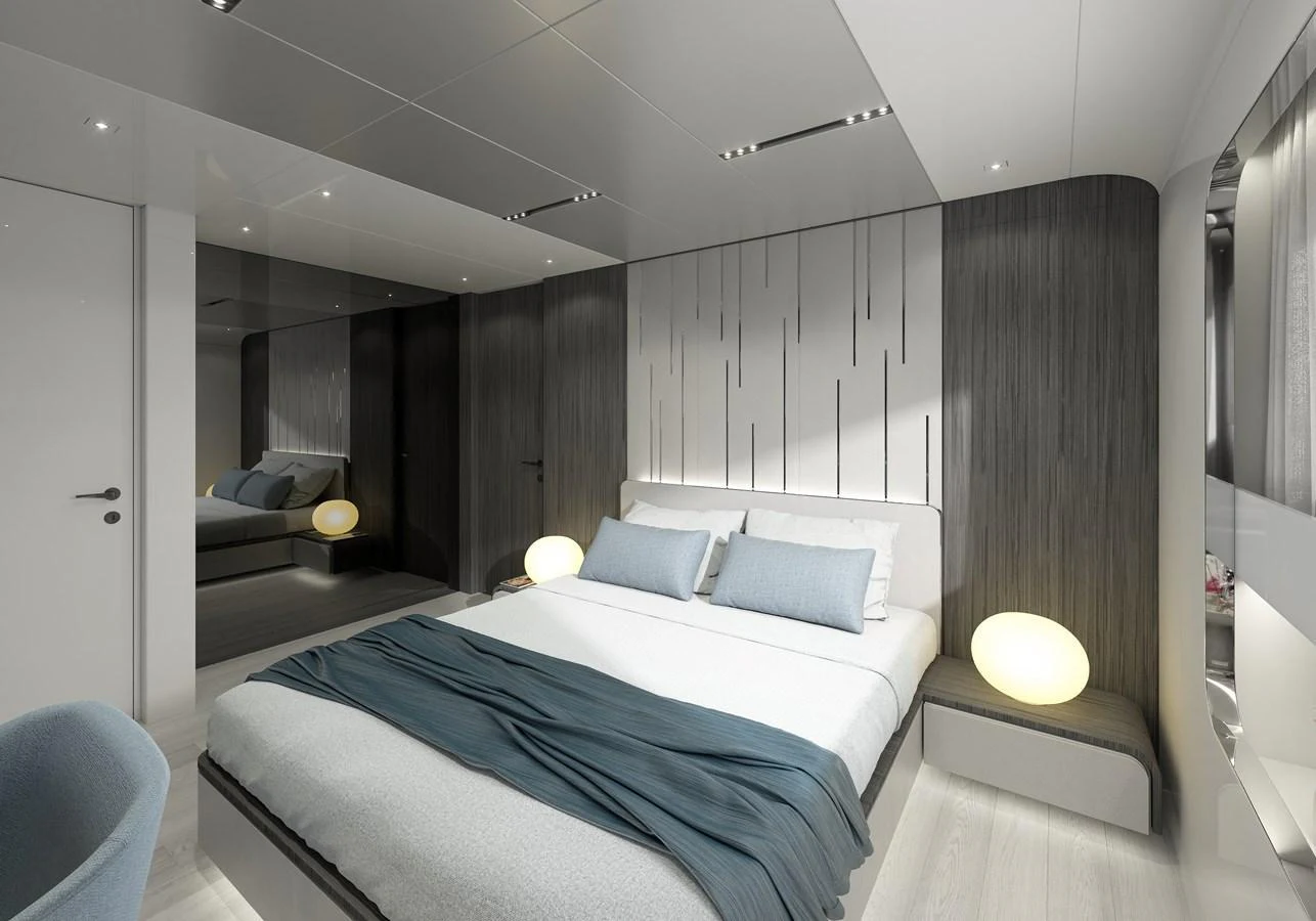 a room with a bed and a couch aboard LEGASEA Yacht for Sale