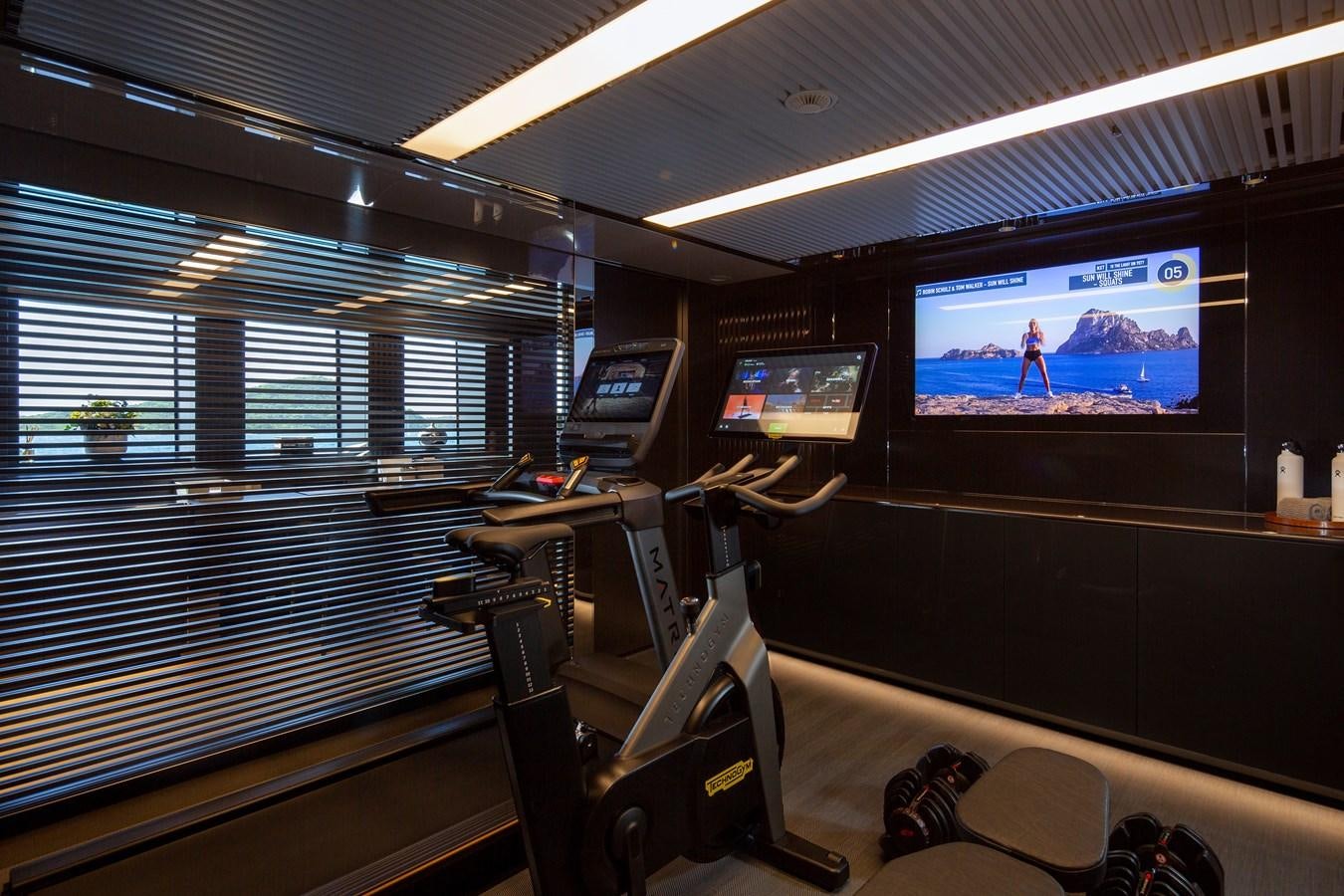 a room with computers and monitors aboard FIFTY Yacht for Sale