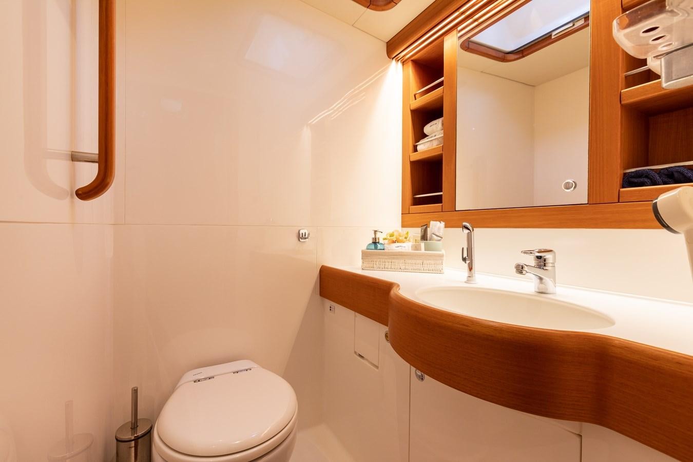 a bathroom with a toilet and a sink aboard NAZCA 2 Yacht for Sale