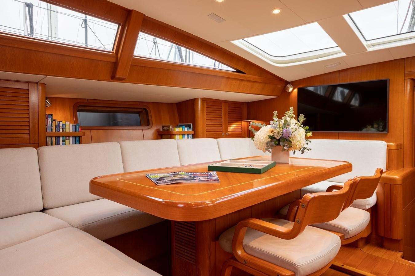 a room with a table and chairs aboard NAZCA 2 Yacht for Sale