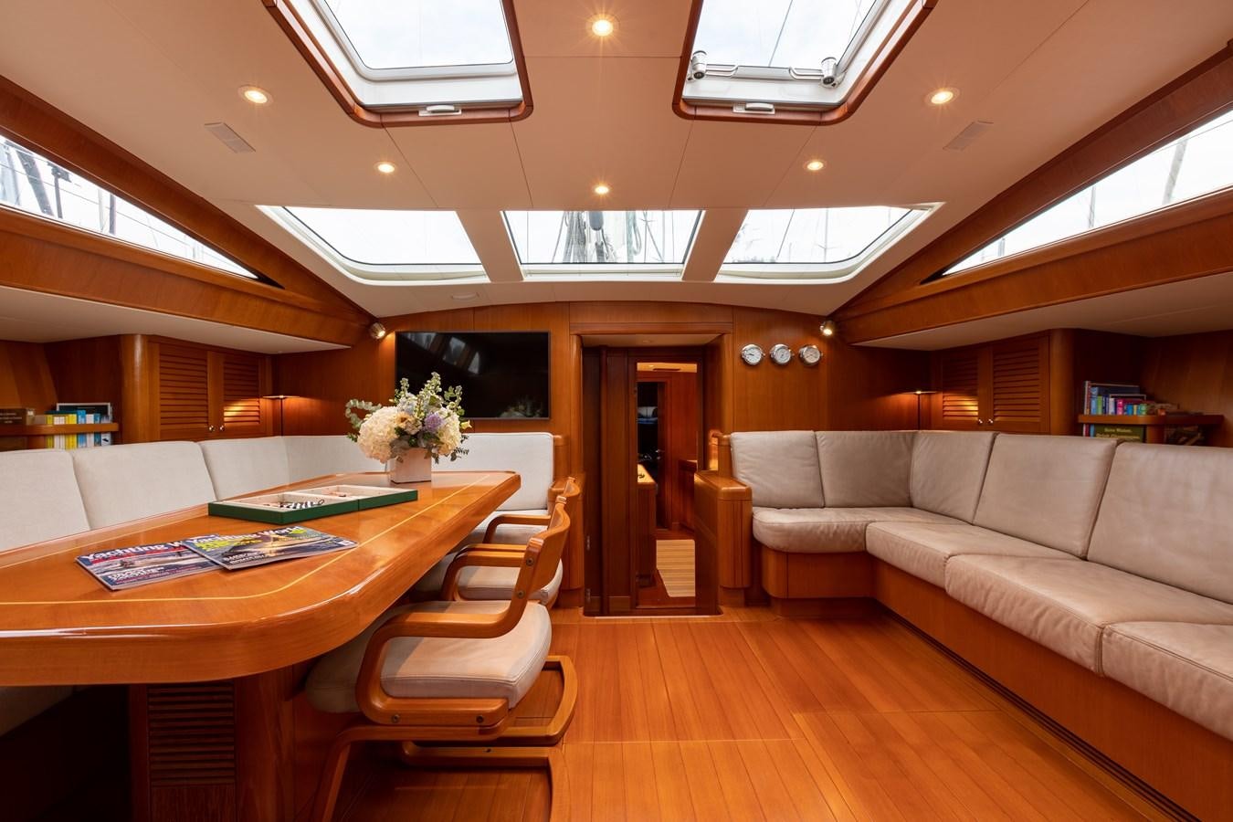 a living room with a couch and a table aboard NAZCA 2 Yacht for Sale
