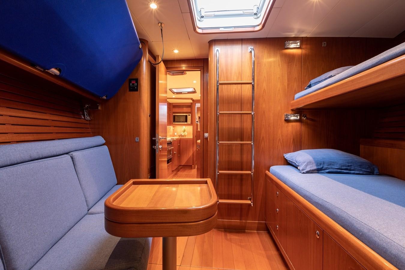 a room with a bed and a couch aboard NAZCA 2 Yacht for Sale