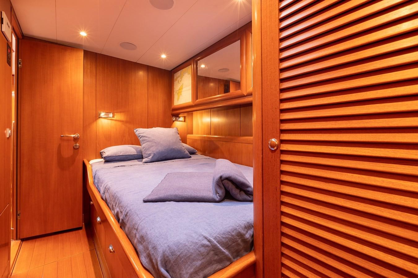 a room with a bed and a closet aboard NAZCA 2 Yacht for Sale