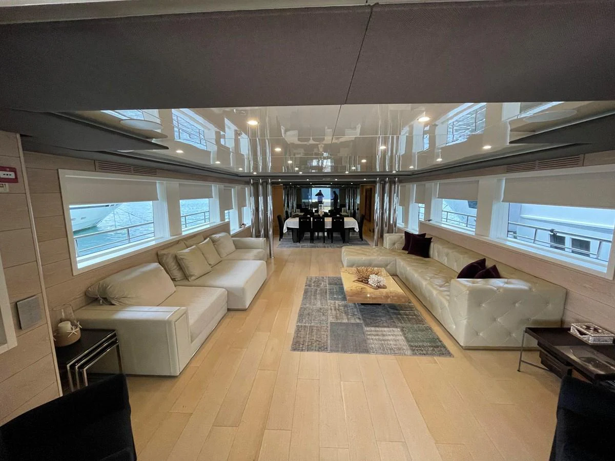 a room with a couch and a table aboard PENNON Yacht for Sale