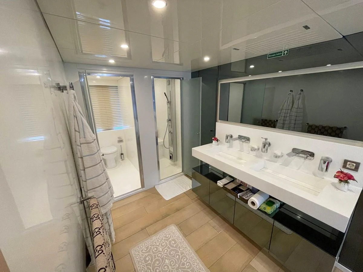 a bathroom with a countertop sink and mirror aboard PENNON Yacht for Sale