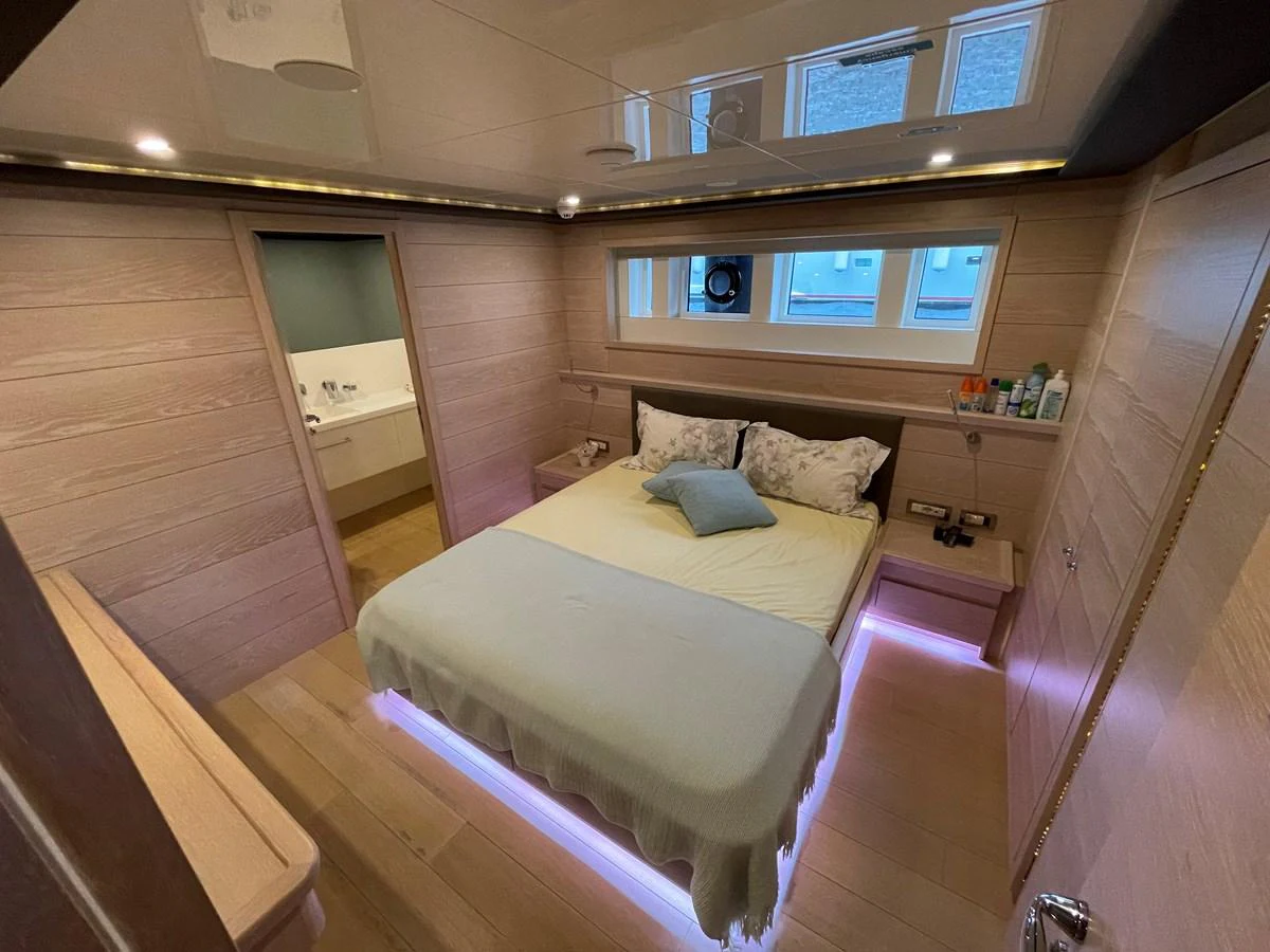 a room with a bed and a desk aboard PENNON Yacht for Sale