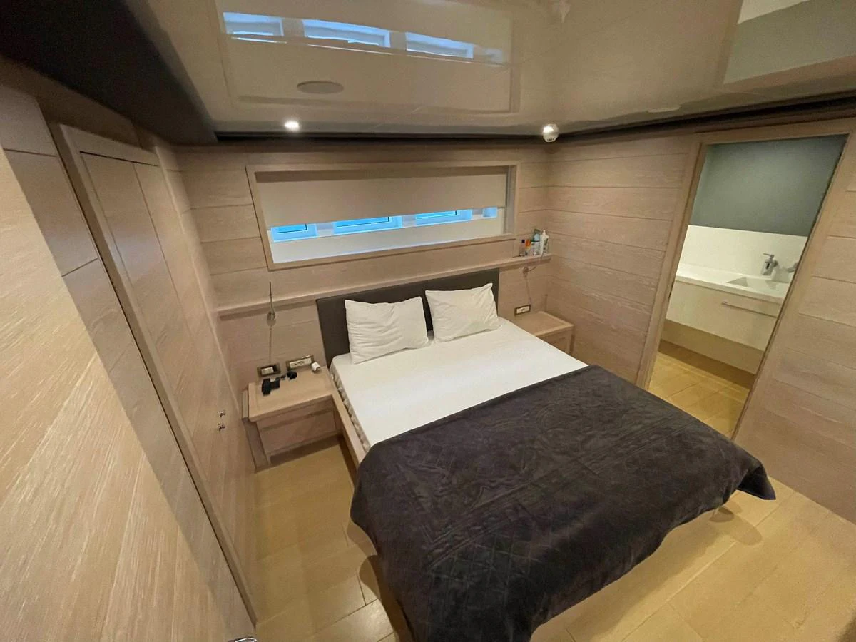 a room with a bed and a desk aboard PENNON Yacht for Sale