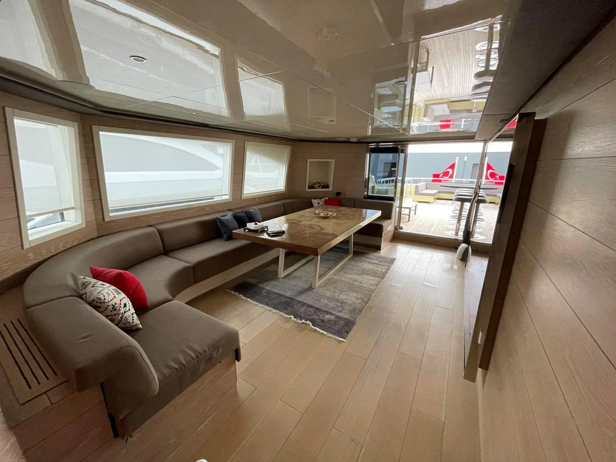 a living room with a couch and a table aboard PENNON Yacht for Sale