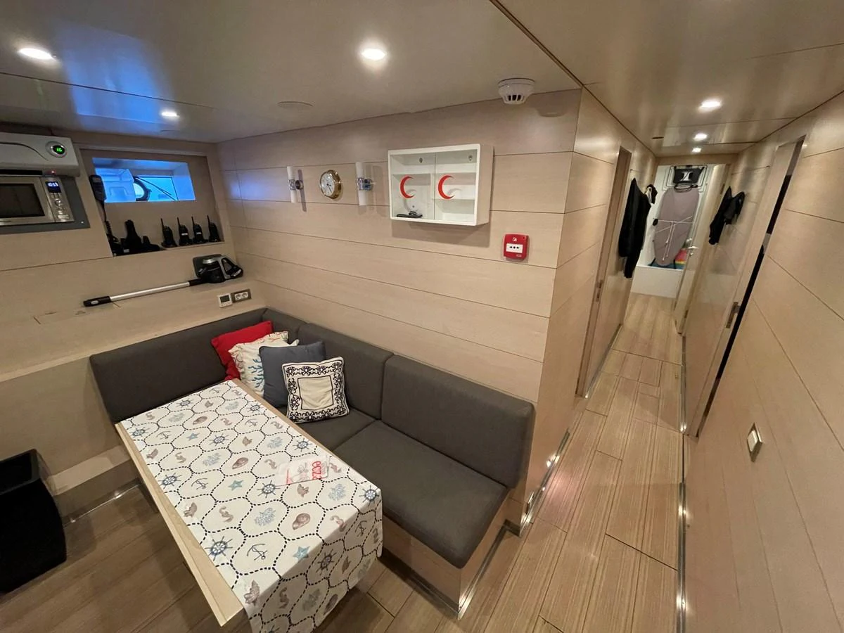 a room with a bed and a couch aboard PENNON Yacht for Sale
