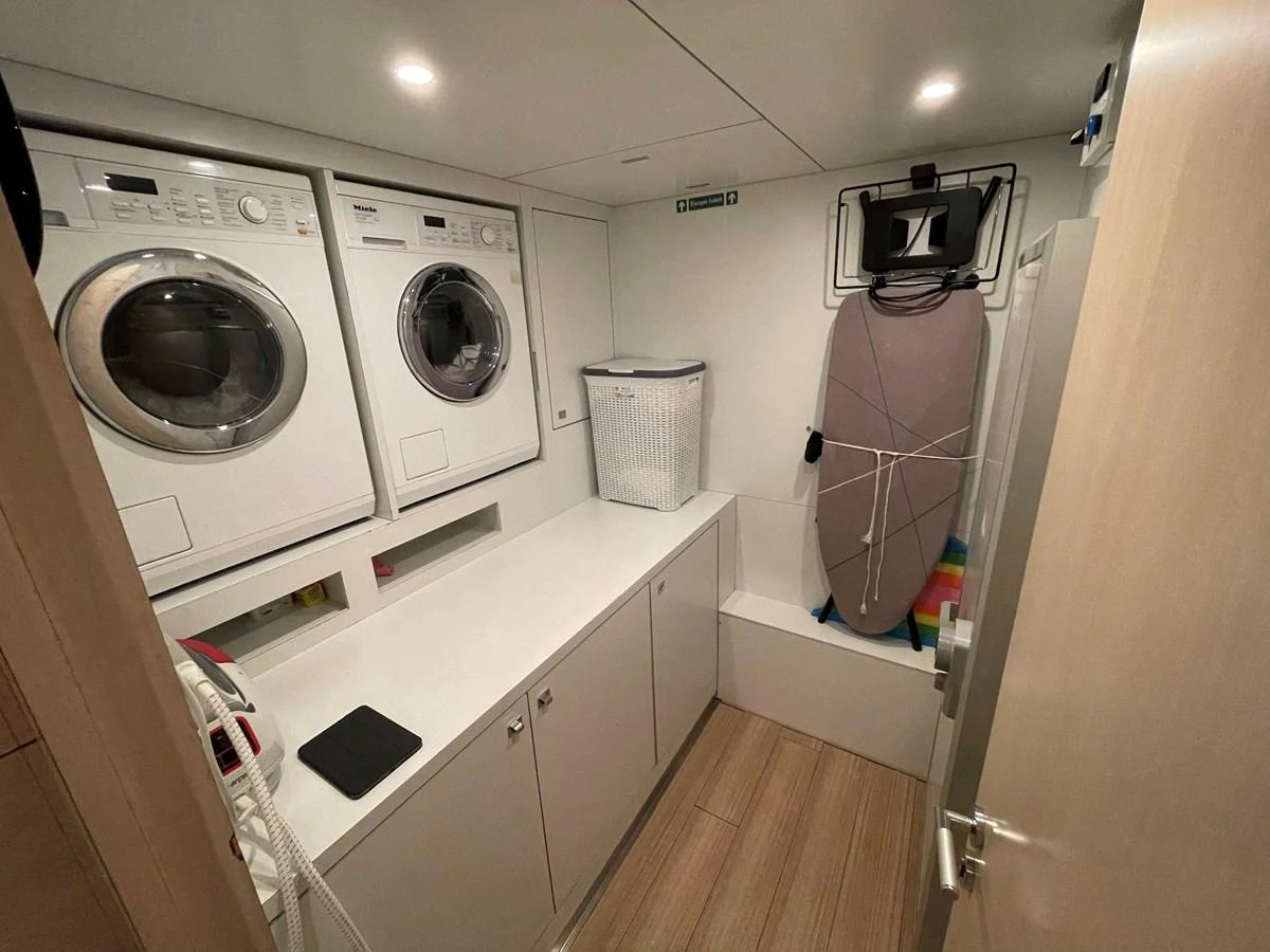 a laundry room with washing machines aboard PENNON Yacht for Sale