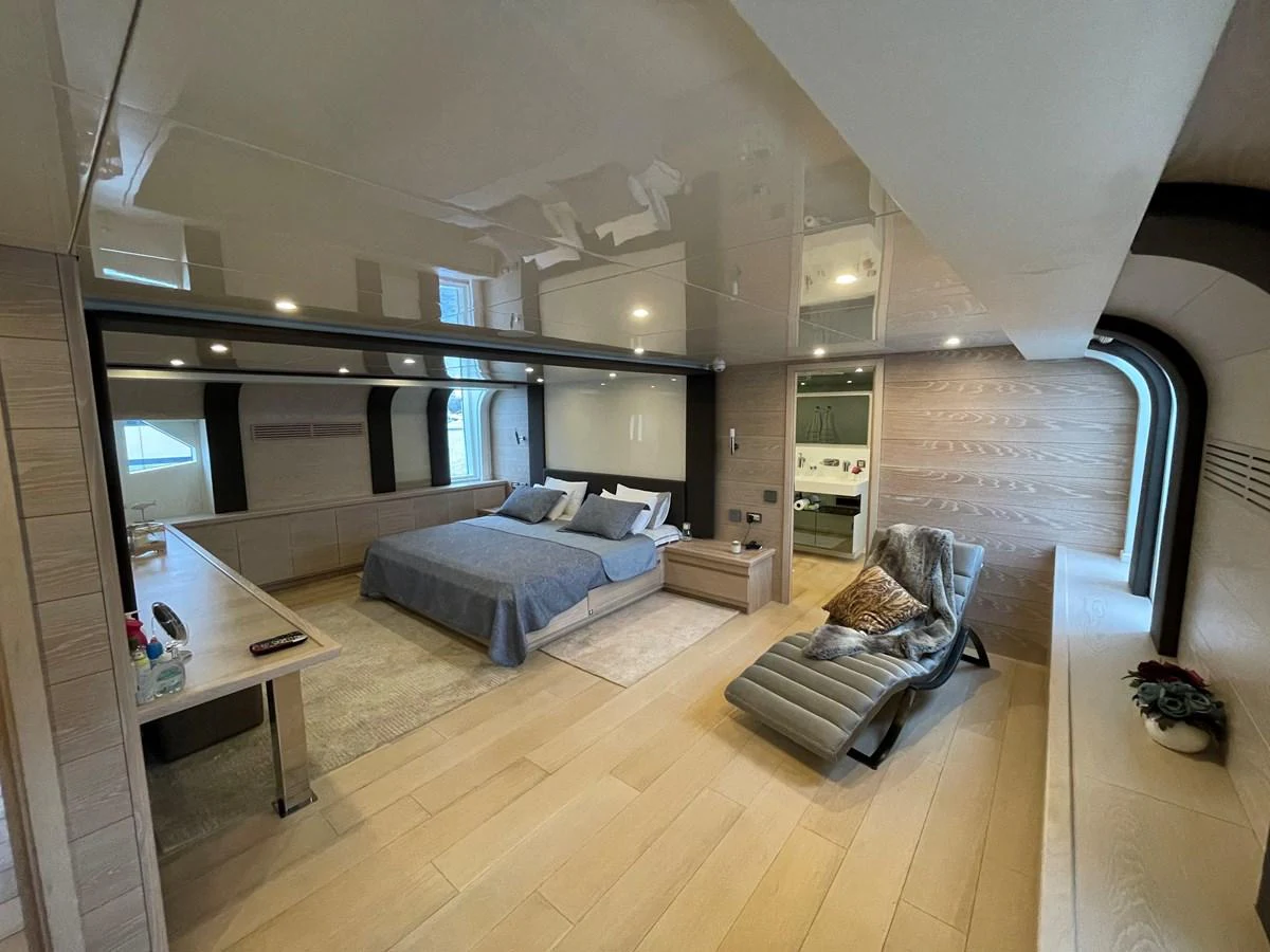 a living room with a couch and a table aboard PENNON Yacht for Sale