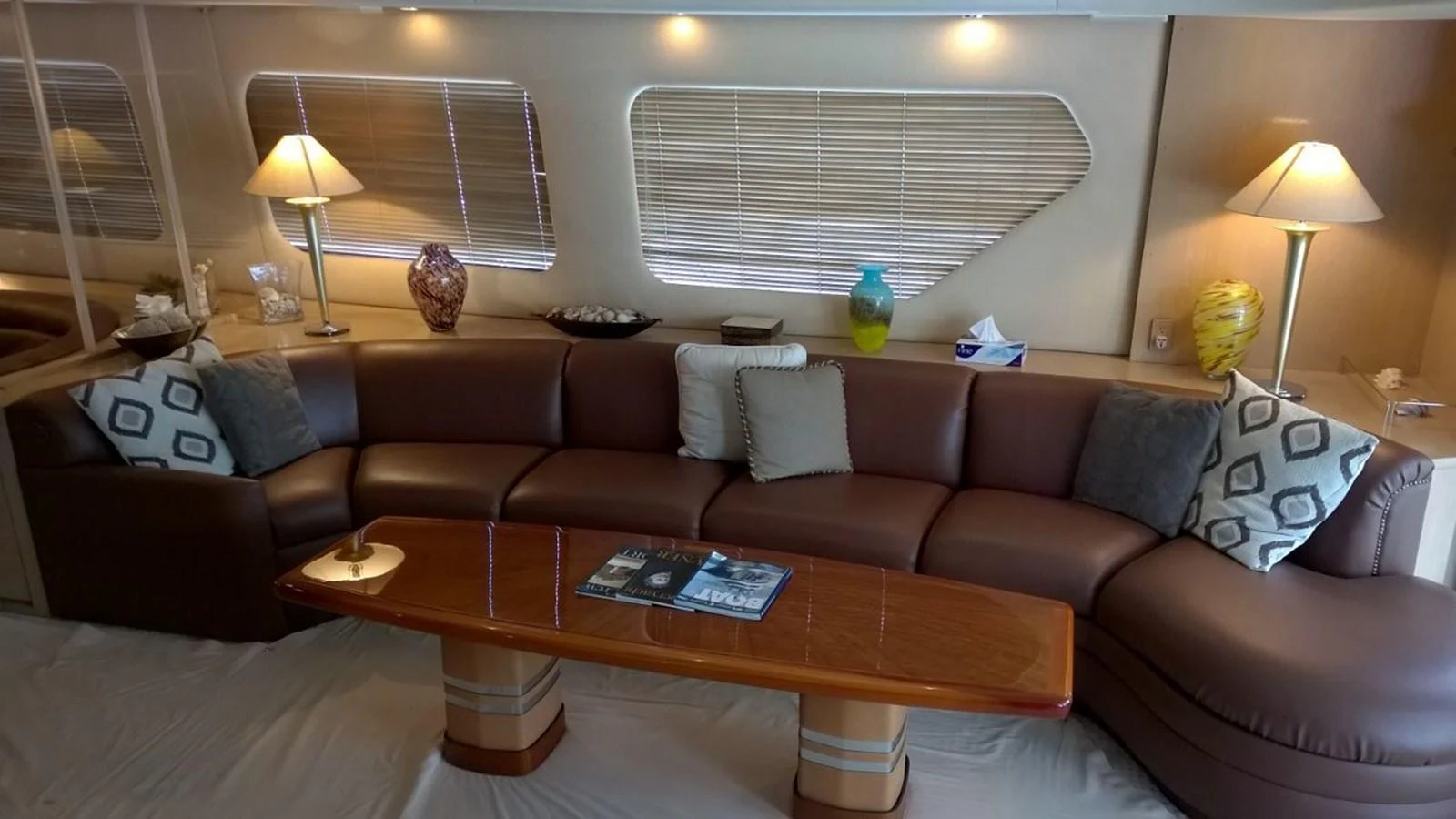 a living room with a couch and a coffee table aboard SEAQUEST Yacht for Sale