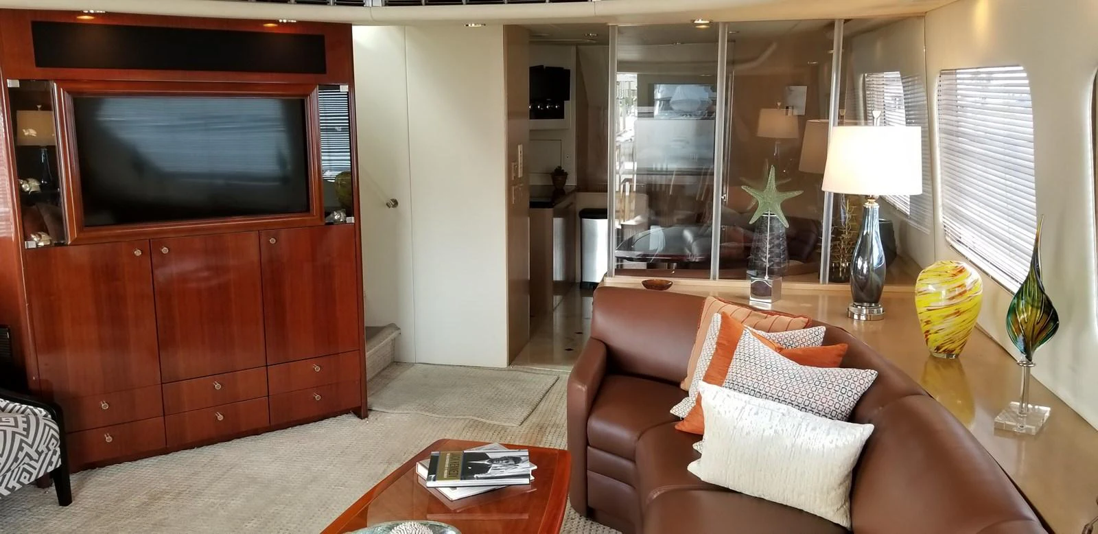 a living room with a couch and a television aboard SEAQUEST Yacht for Sale
