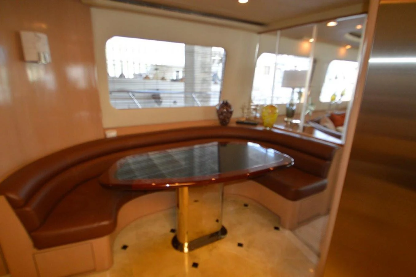 a table and a couch in a room aboard SEAQUEST Yacht for Sale