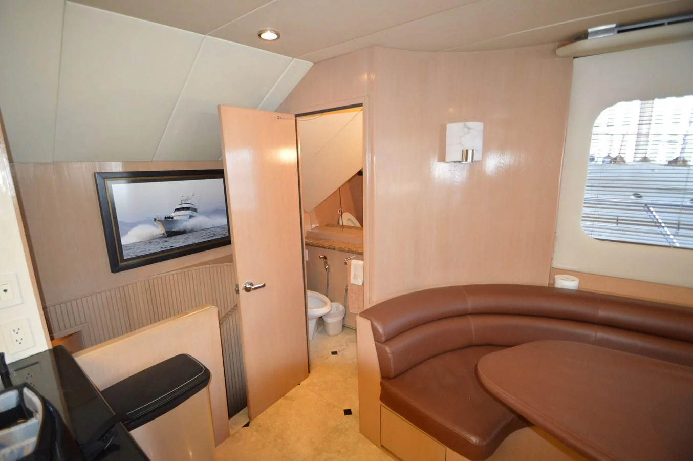 a room with a couch and a television aboard SEAQUEST Yacht for Sale