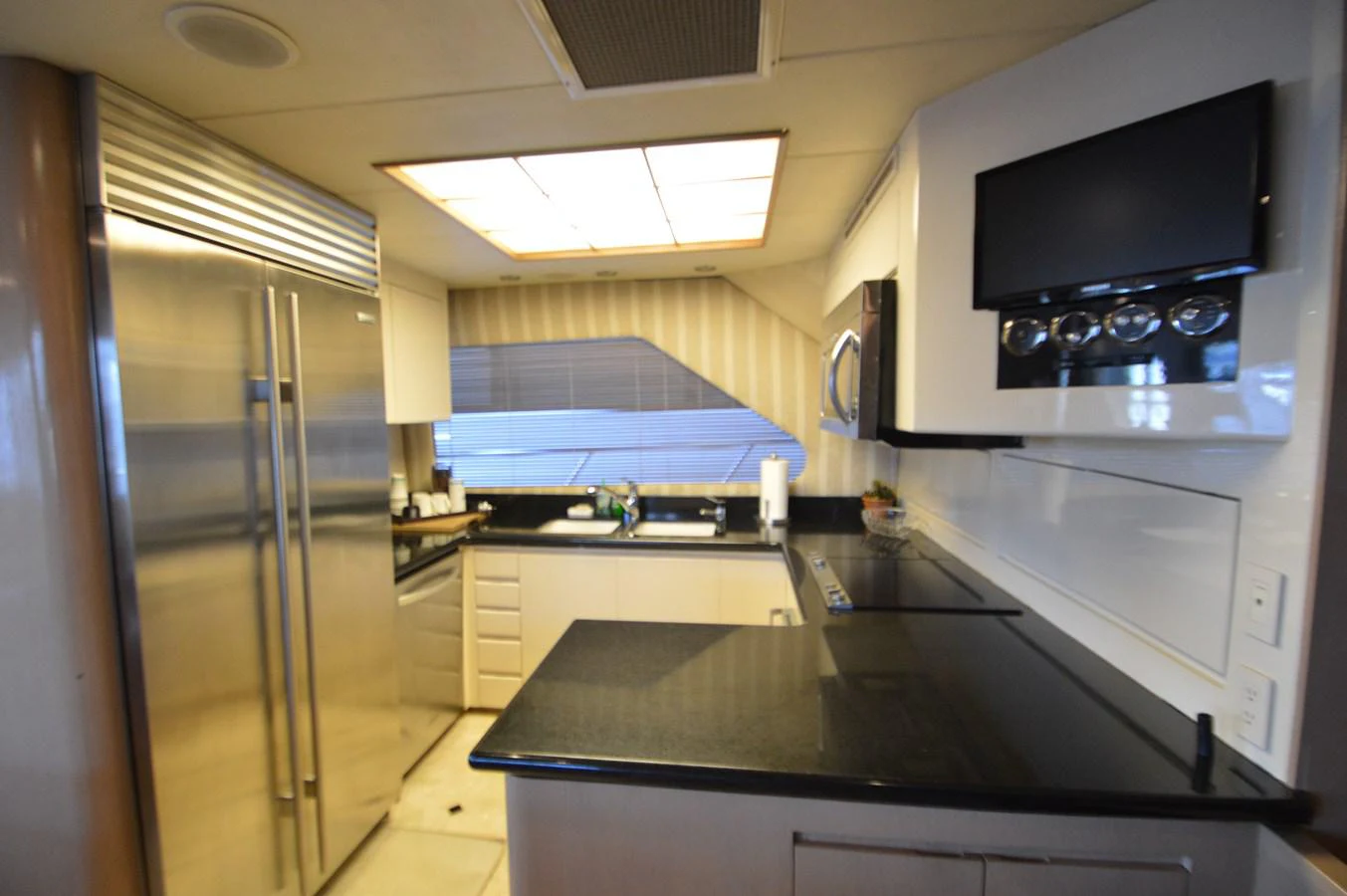 a kitchen with a large microwave oven aboard SEAQUEST Yacht for Sale