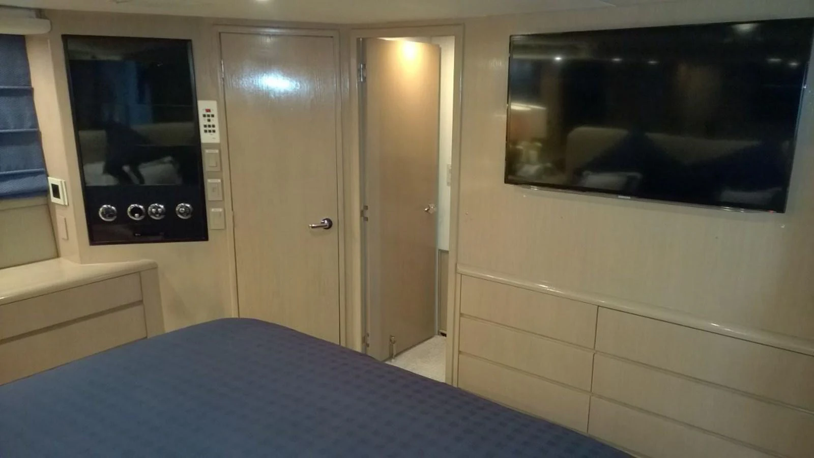 a room with a bed and a microwave aboard SEAQUEST Yacht for Sale