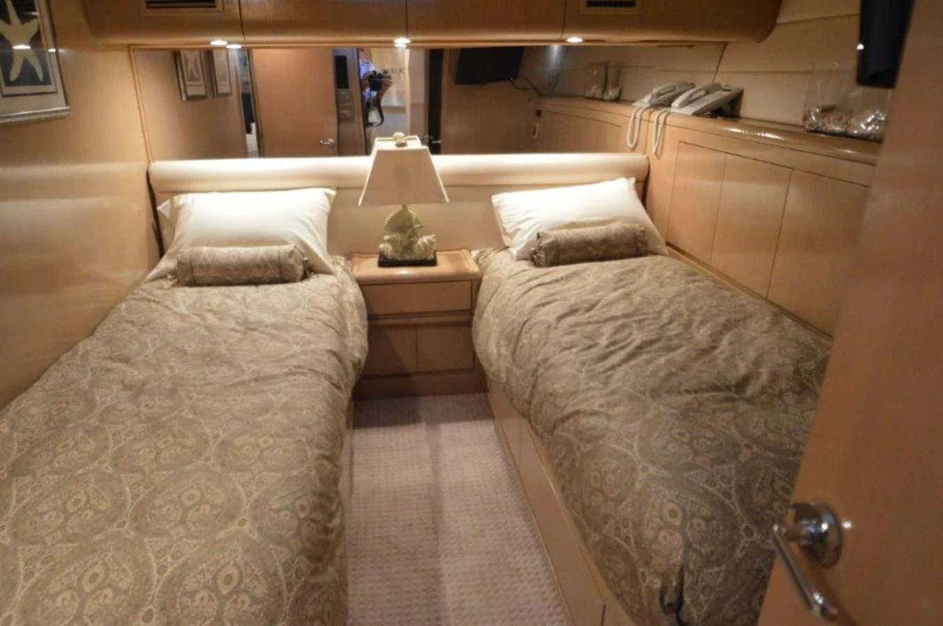 a couple of beds in a hotel room aboard SEAQUEST Yacht for Sale