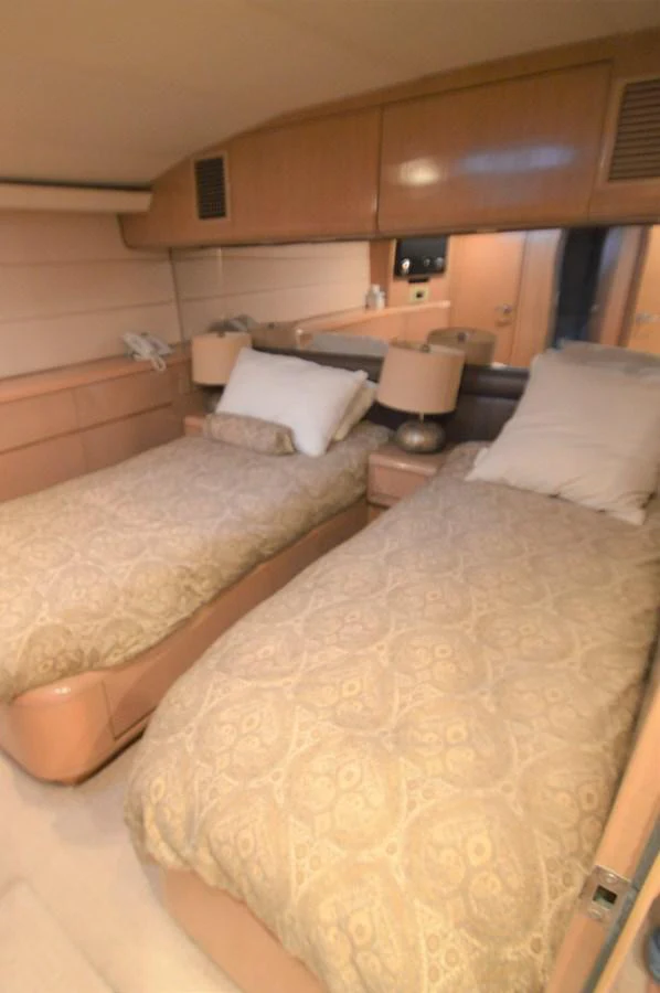 a couple of beds in a hotel room aboard SEAQUEST Yacht for Sale