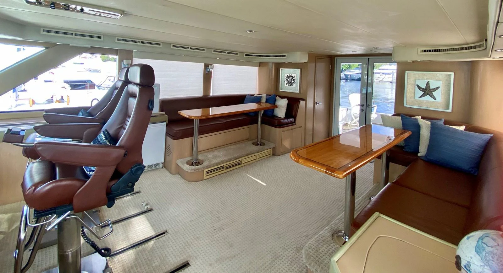 a room with a table and chairs aboard SEAQUEST Yacht for Sale