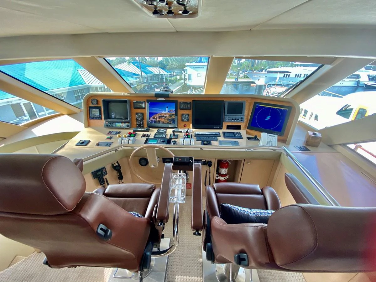 a room with many monitors and chairs aboard SEAQUEST Yacht for Sale