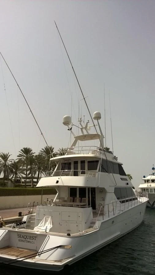 a white boat with a white sail aboard SEAQUEST Yacht for Sale