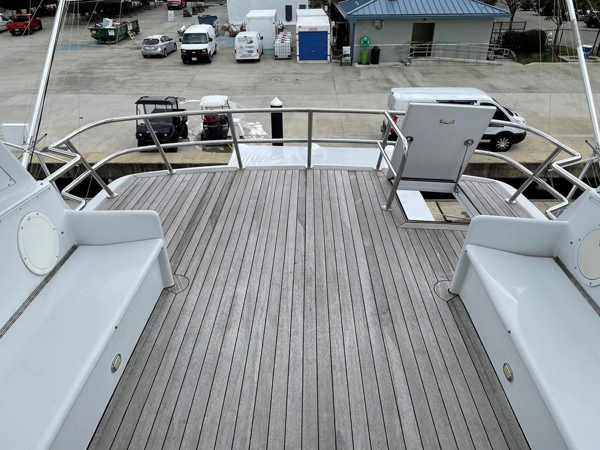 a deck with a car parked on it aboard SEAQUEST Yacht for Sale