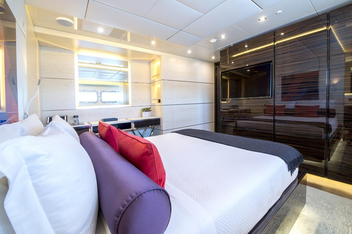 a room with a bed and a window aboard AXIOS Yacht for Sale