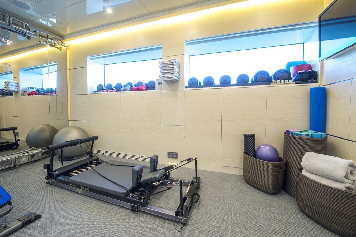 a room with balls and chairs aboard AXIOS Yacht for Sale