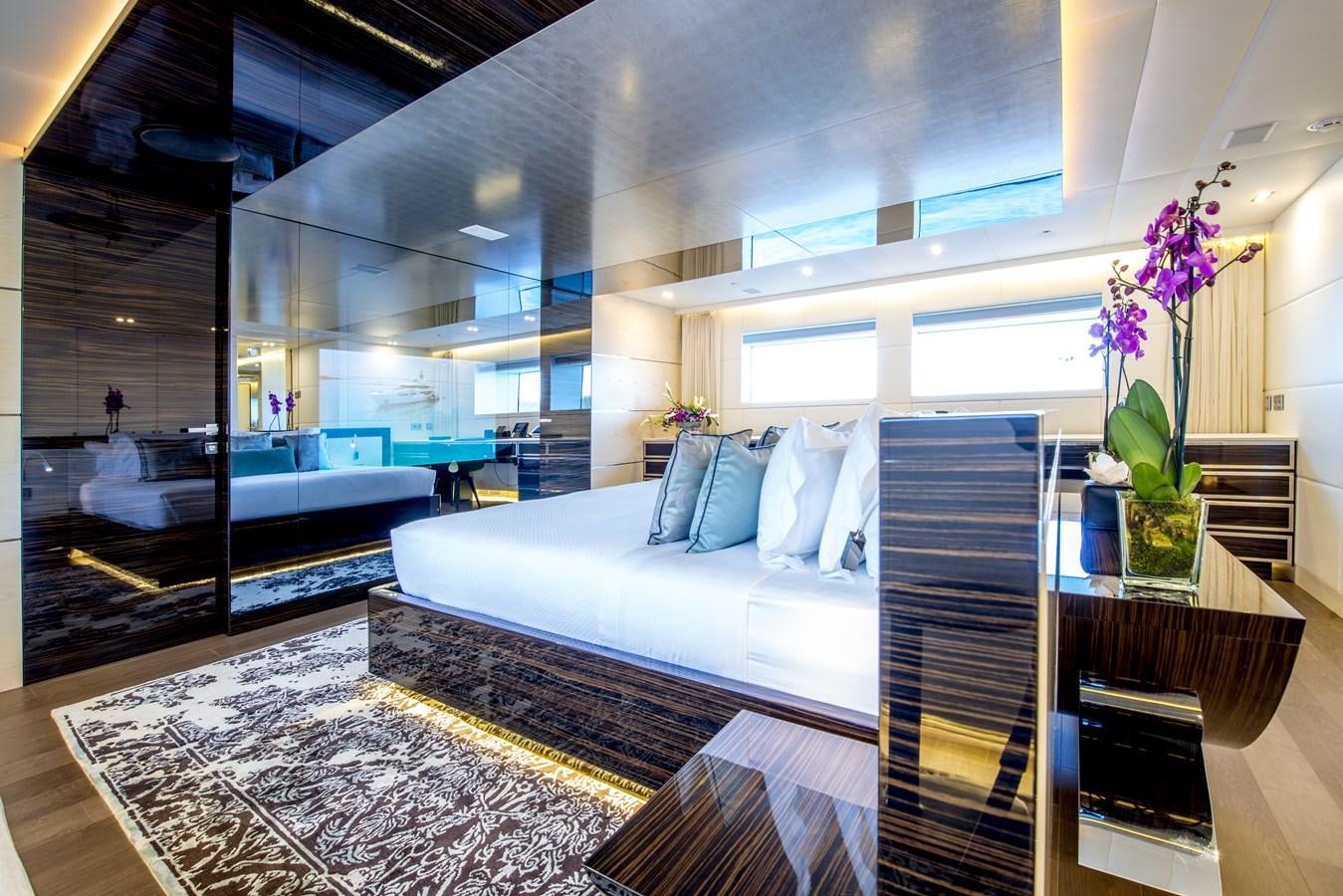 a room with a bed and a table aboard AXIOS Yacht for Sale