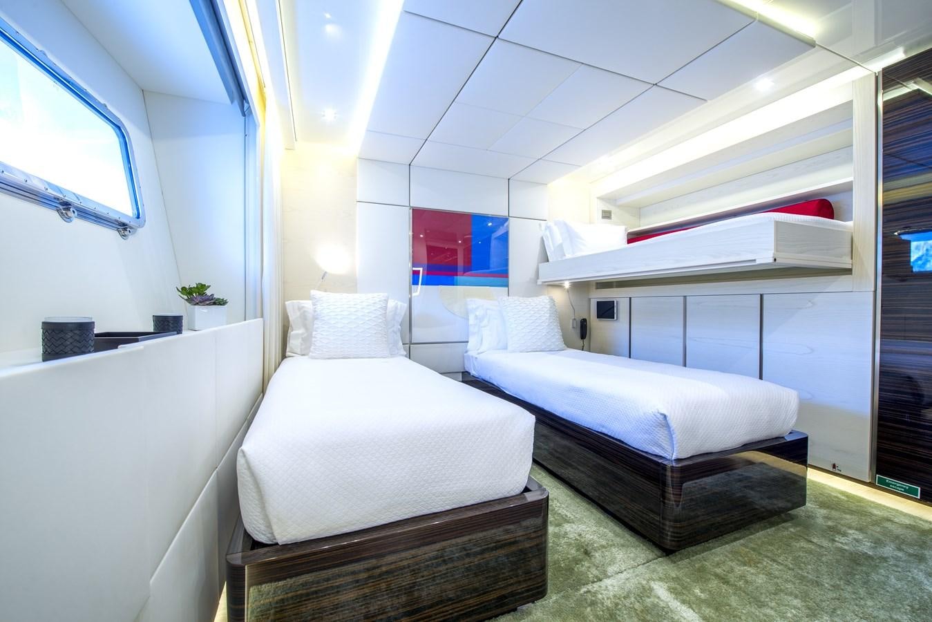 a room with a bed and a shelf aboard AXIOS Yacht for Sale