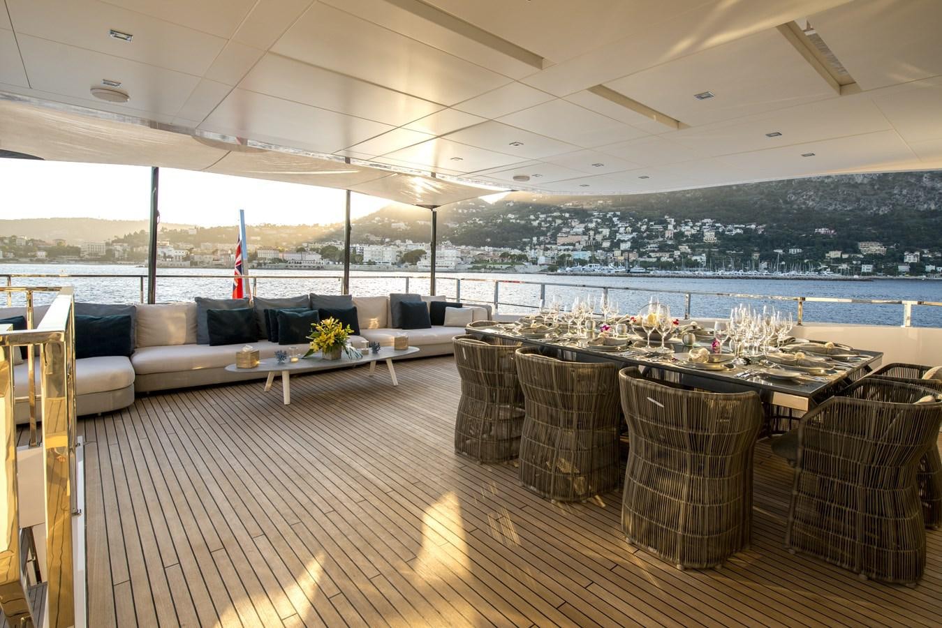 a room with a table and chairs aboard AXIOS Yacht for Sale