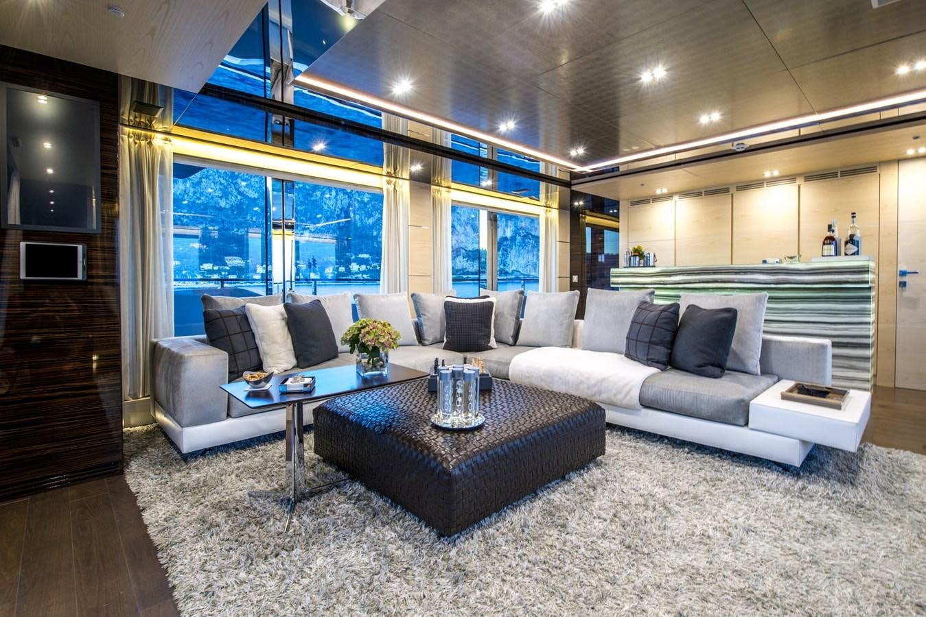 a living room with a large window aboard AXIOS Yacht for Sale