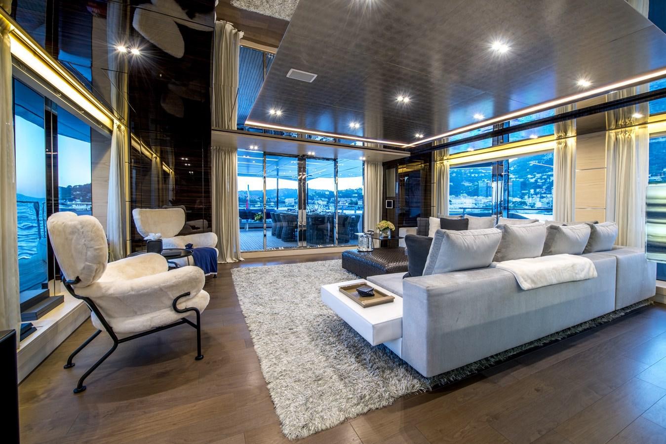 a living room with a large window aboard AXIOS Yacht for Sale
