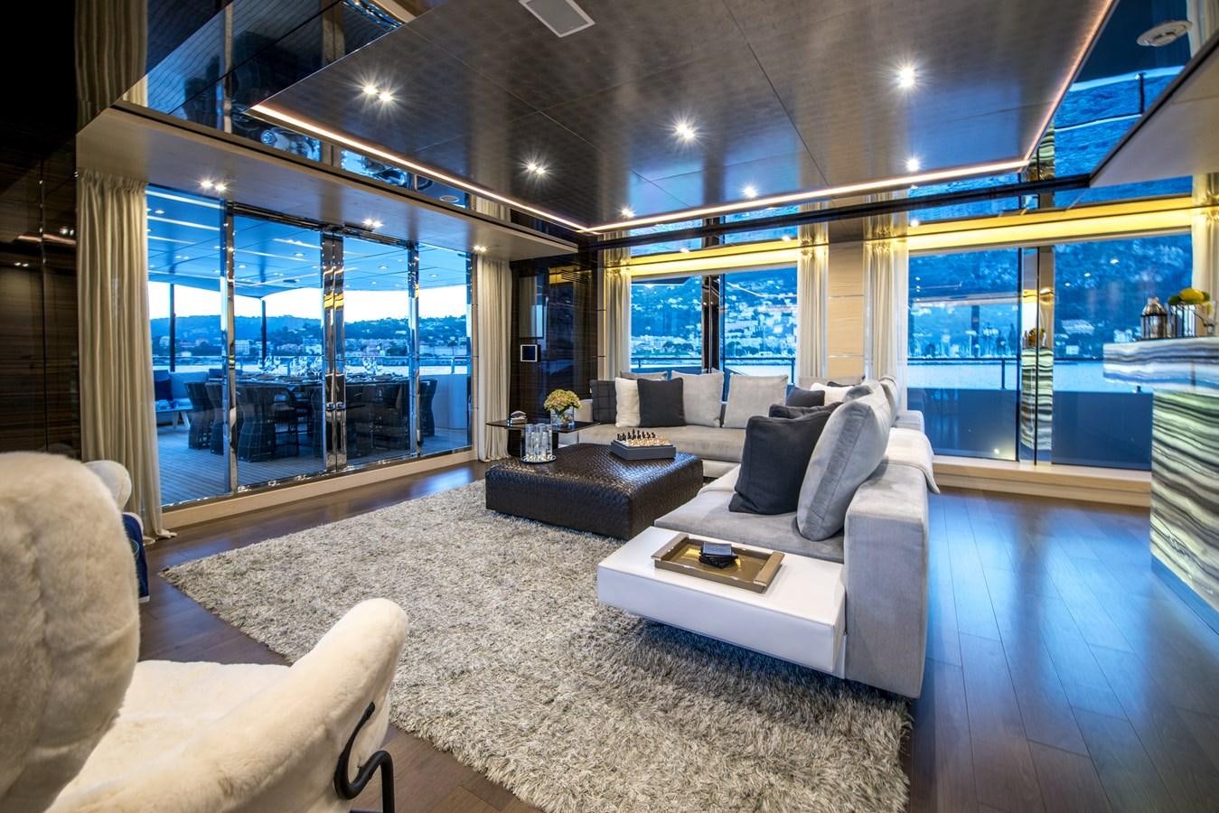 a living room with a large glass wall aboard AXIOS Yacht for Sale