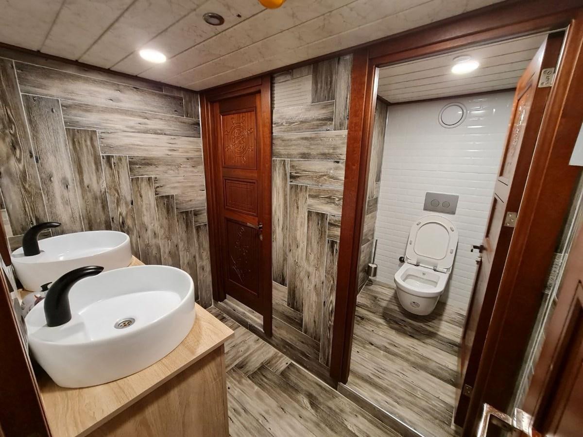 a bathroom with a sink toilet and a shower aboard SINAN BEY Yacht for Sale
