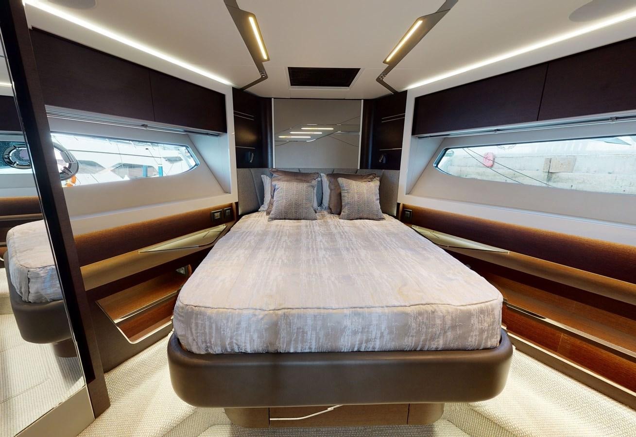 a room with a bed and a window aboard FIVE II Yacht for Sale