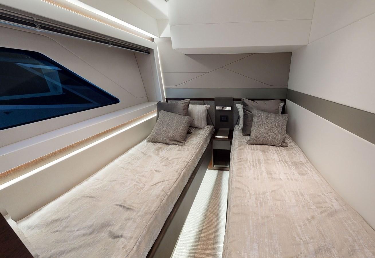 a room with a bed and a couch aboard FIVE II Yacht for Sale