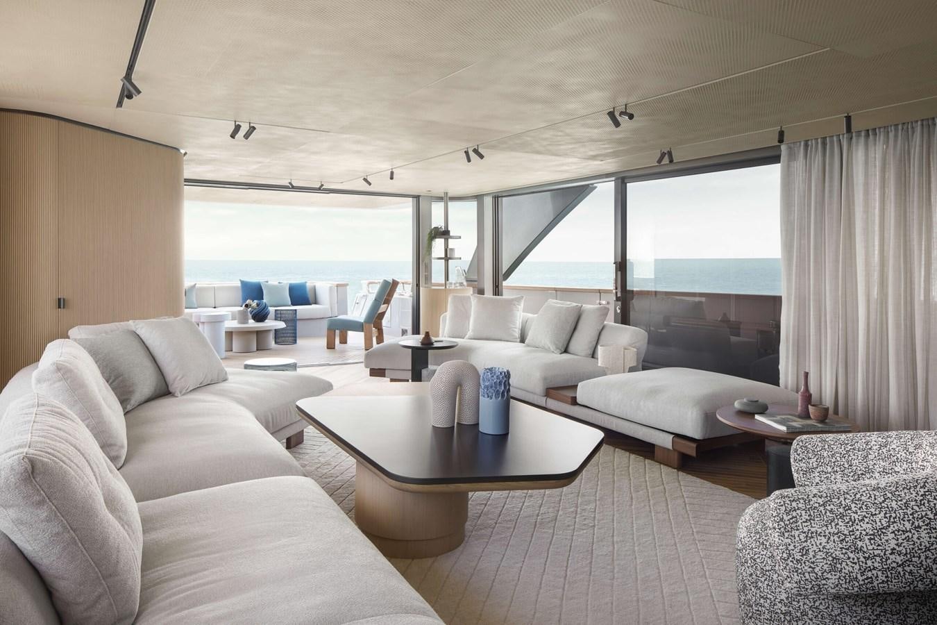 a living room with a large window aboard LA BREZZA Yacht for Sale