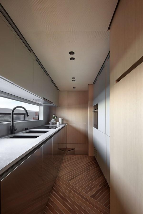 a kitchen with a wood floor aboard LA BREZZA Yacht for Sale