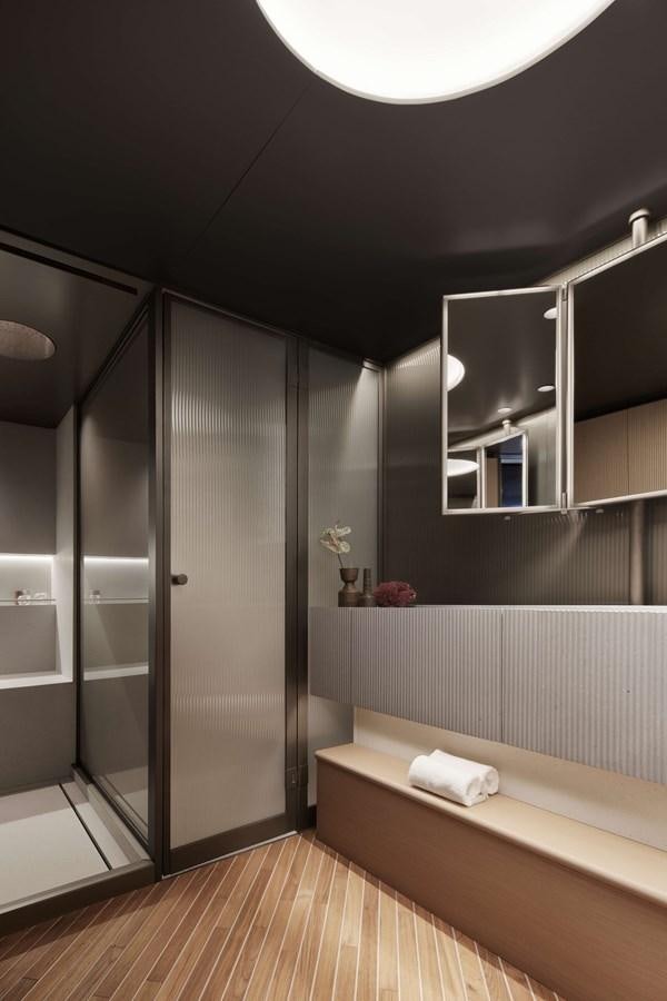 a bathroom with a shower unit and a sink aboard LA BREZZA Yacht for Sale