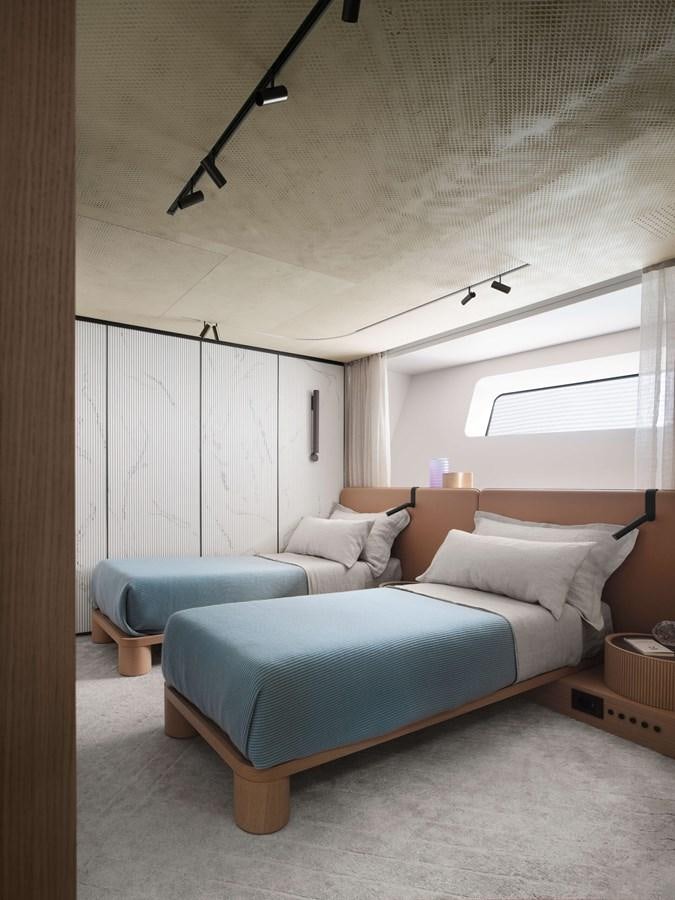 a bedroom with a bed and a desk aboard LA BREZZA Yacht for Sale