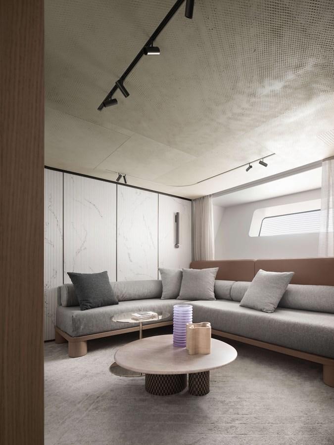 a living room with a couch and a coffee table aboard LA BREZZA Yacht for Sale
