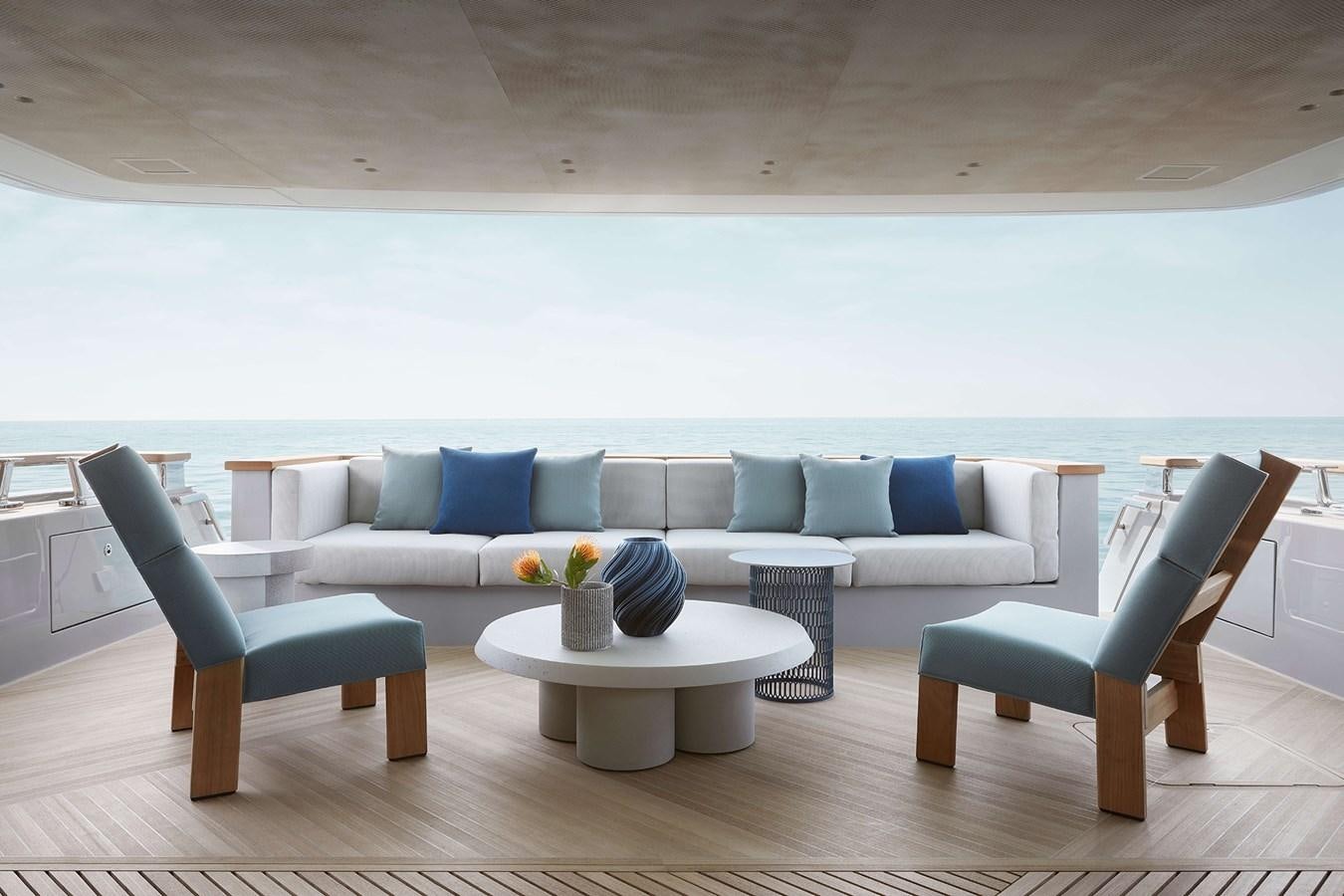 a living room with a couch and a table aboard LA BREZZA Yacht for Sale