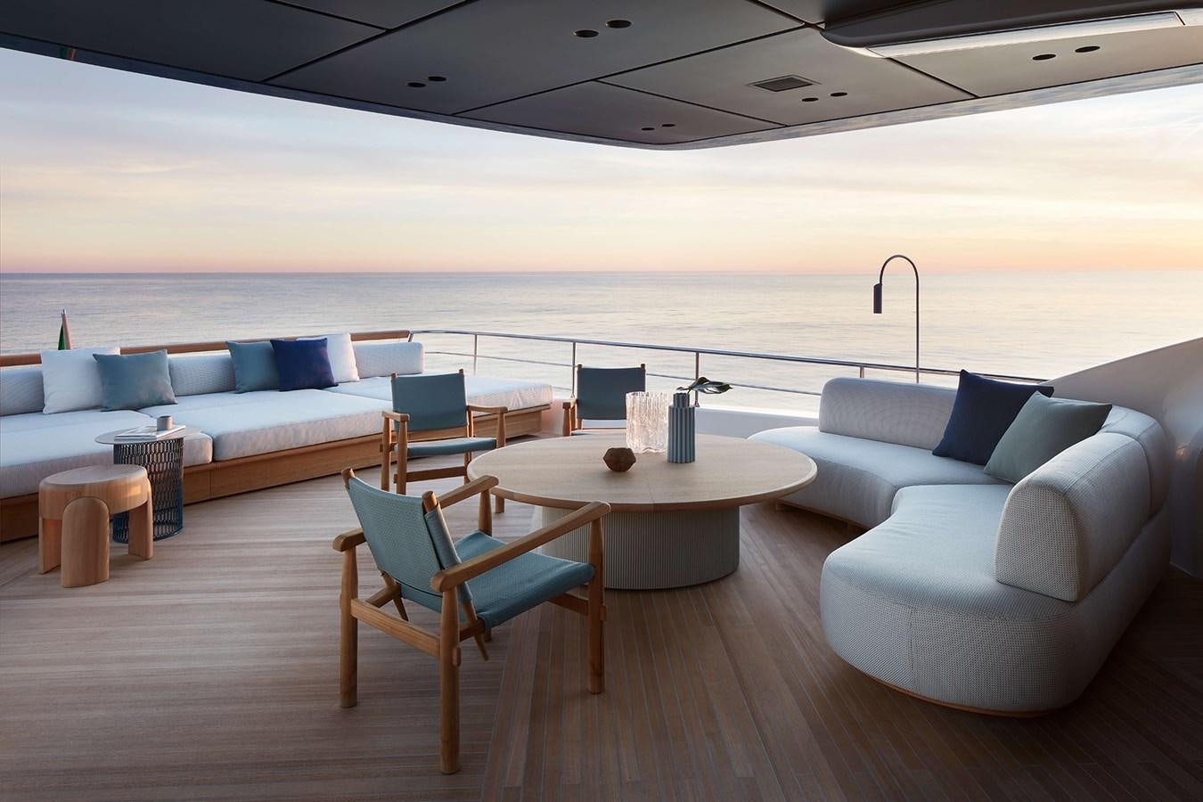 a room with a table and chairs aboard LA BREZZA Yacht for Sale