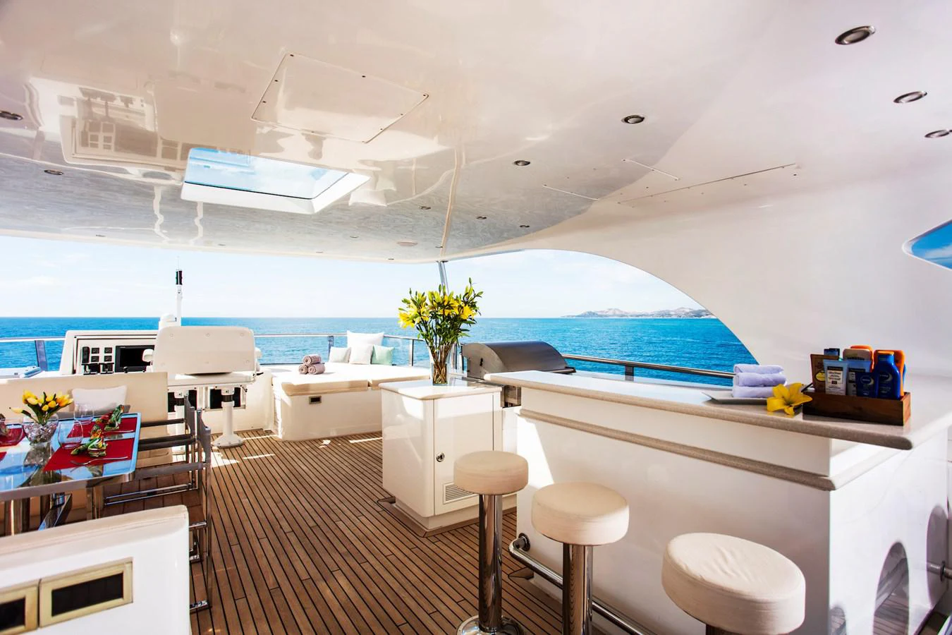 a room with a table and chairs aboard KOMOKWA Yacht for Charter
