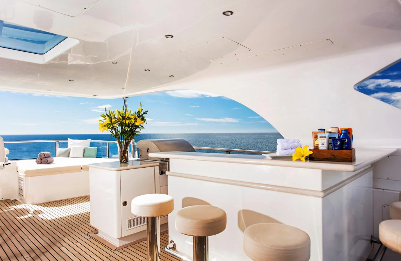 a room with a large window and a view of the ocean aboard KOMOKWA Yacht for Charter