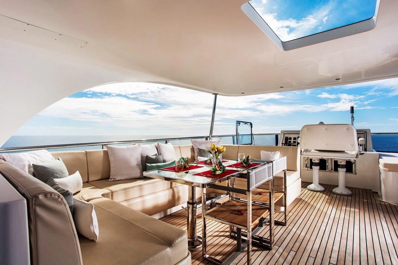 a room with a table and chairs aboard KOMOKWA Yacht for Charter